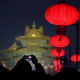 A visitor takes a picture of the Forbidden City decorated with red lanterns that is lit up during an event to celebrate the Chinese Lantern Festival on the last day of the lunar new year celebrations in Beijing, China February 19, 2019.